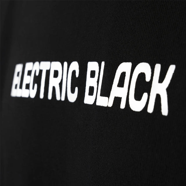 Black Electric Black t-shirt with a mock neck collar. Detail of the Electric Black logo.